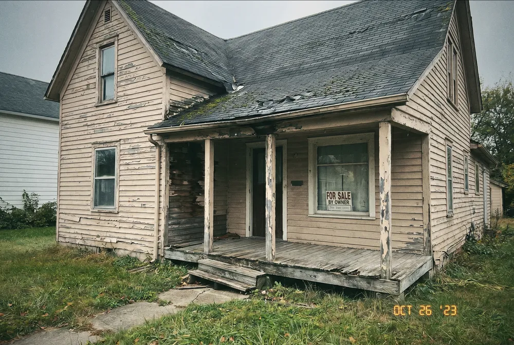 A flagged run-down listing photo